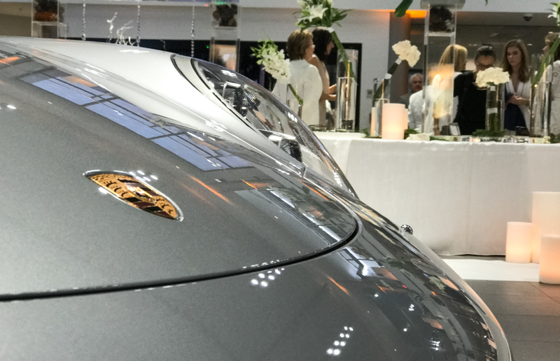Illustration for article titled This Couple Topped Your Wildest Dreams By Getting Married In A Porsche Showroom